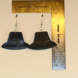 Pair of earrings shaped like black pilgrim hats with gold buckles.