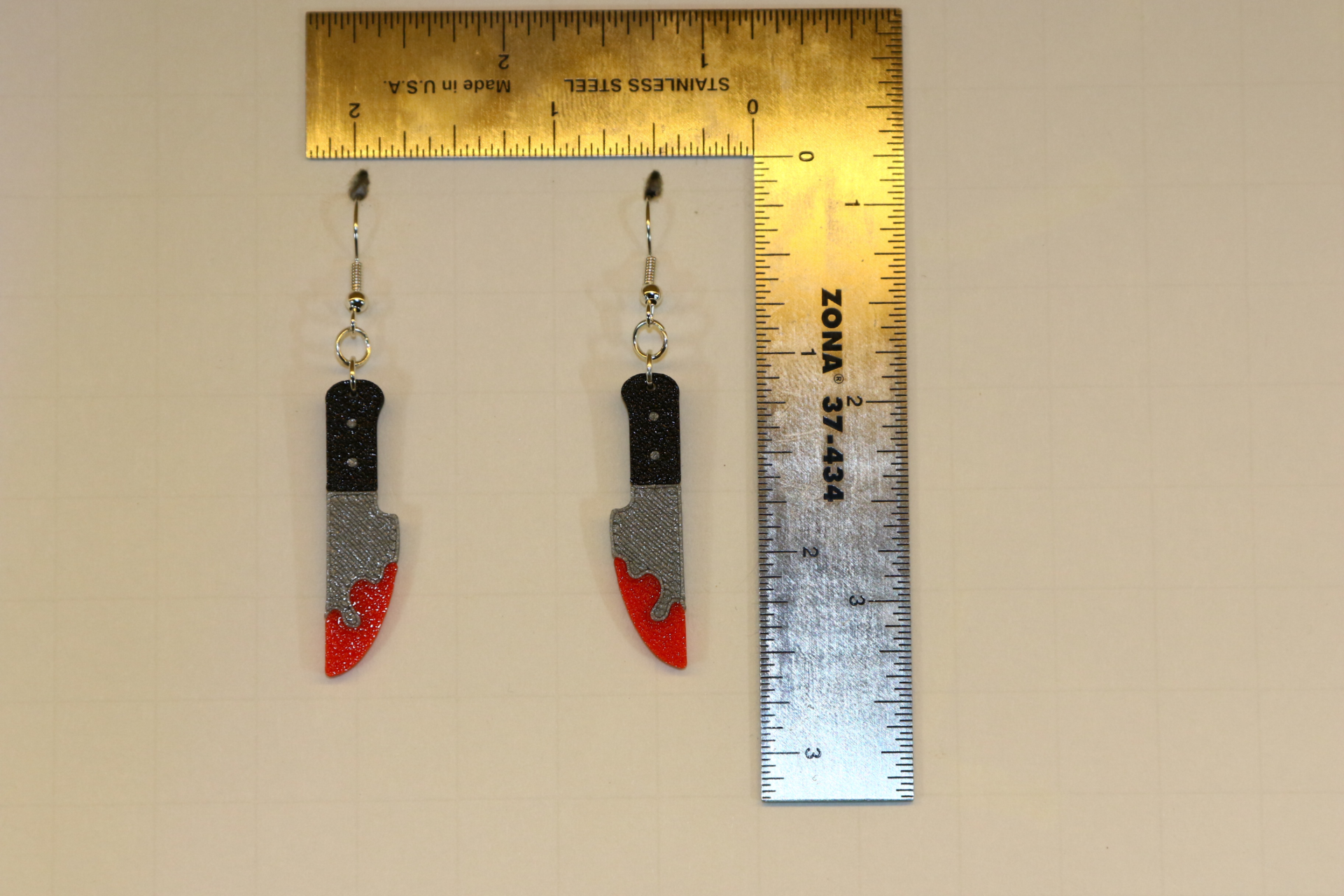 Bloody knife earrings, horror-themed Halloween jewelry