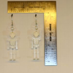 Skeleton-themed earrings with detailed skull and bone design