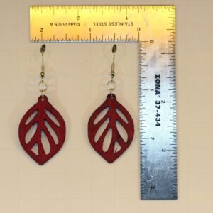 Wooden leaf-shaped earrings with cutout detailing.