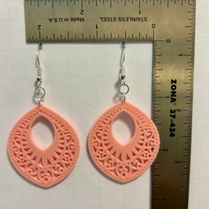 Lace-patterned boho earrings with delicate cutout design.