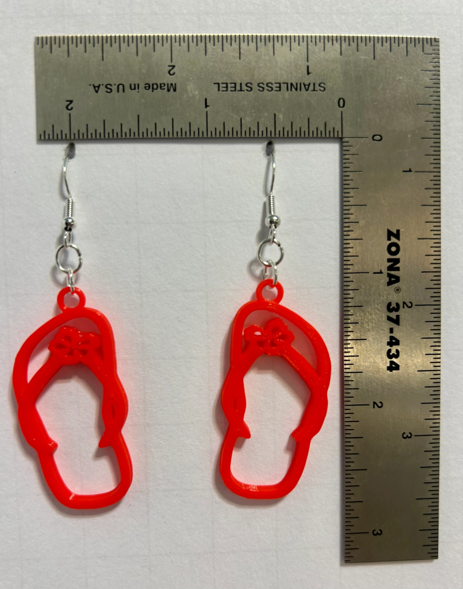 Flip flop-shaped earrings with beachy boho style.