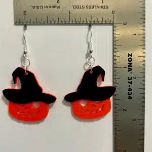 Pumpkin-shaped earrings with tiny black witch hats