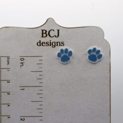 Paw print stud earrings featuring simple paw design