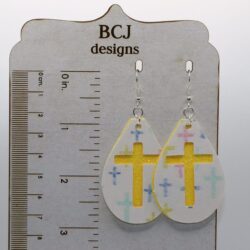 Faux leather cross-shaped earrings in a minimalist Easter design.