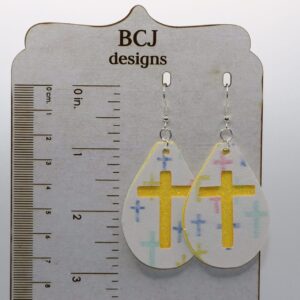 Faux leather cross-shaped earrings in a minimalist Easter design.
