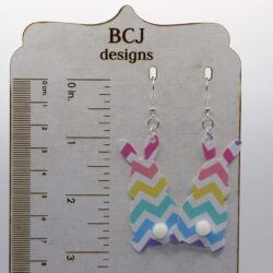 Faux leather bunny earrings with small fluffy tail accents.