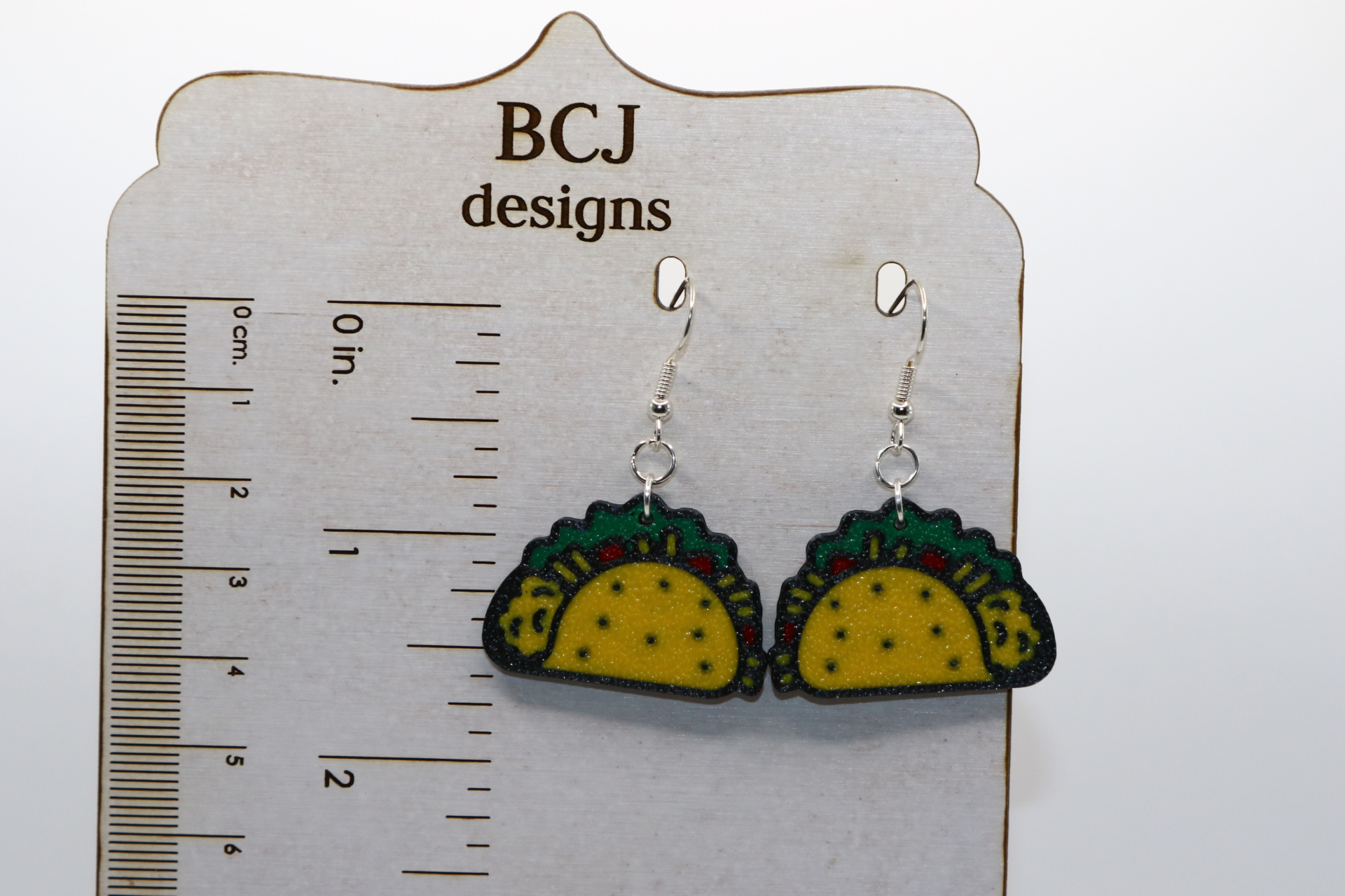 Taco-shaped earrings with colorful design, festive accessory
