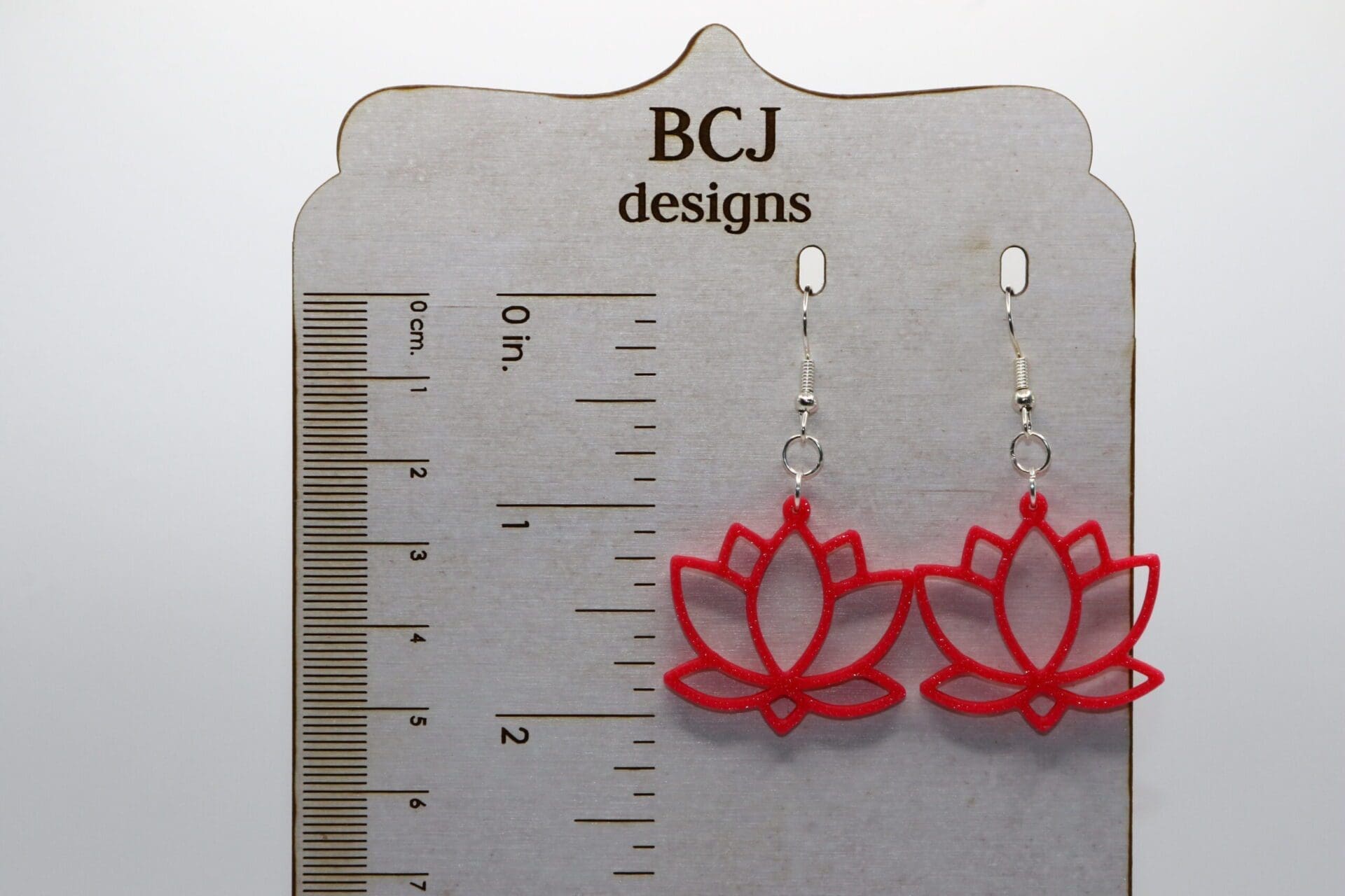 Lotus earrings with delicate flower shape and detailing.