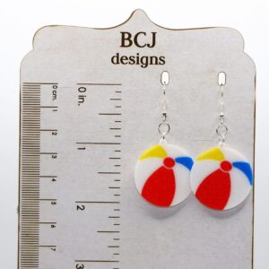 pair of beach ball earrings on a display
