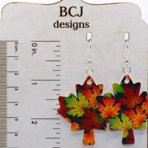 Earrings shaped like autumn-colored faux leather maple leaves