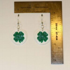 Pair of earrings shaped like green and white clovers.