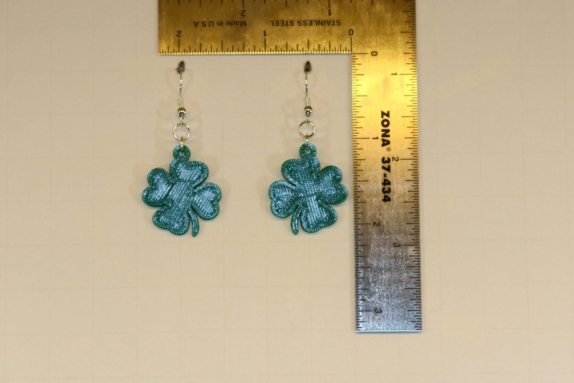 Pair of earrings shaped like classic green shamrocks.