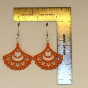 mandala fan earring on a display for size