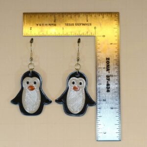 Penguin earrings featuring cute black-and-white penguin design.