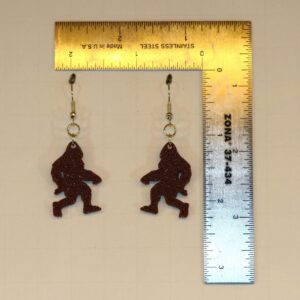 Bigfoot earrings featuring silhouette of forest creature.