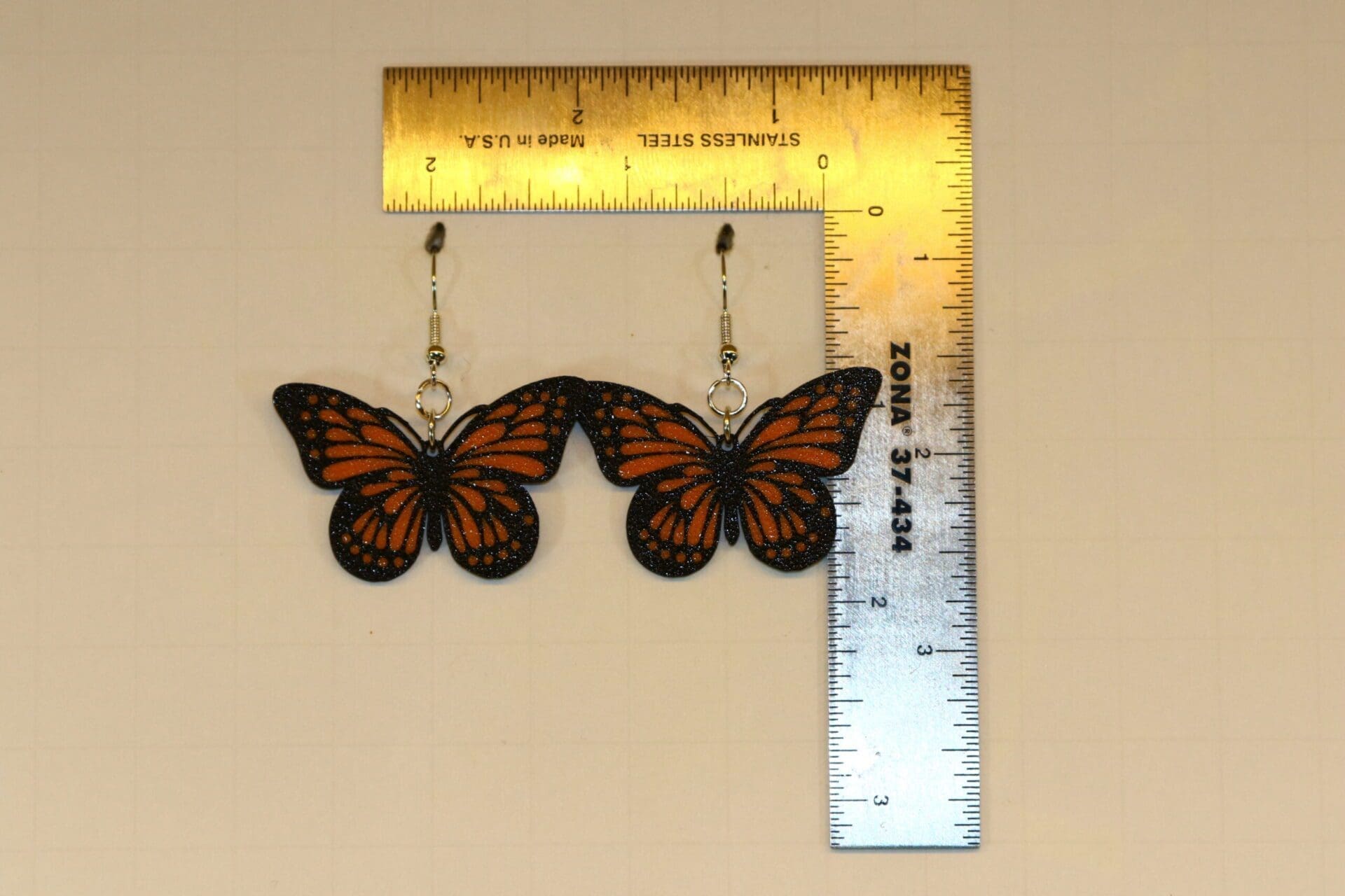 Butterfly earrings featuring detailed butterfly wings.