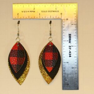 Plaid and glitter faux leather earrings with festive shine.