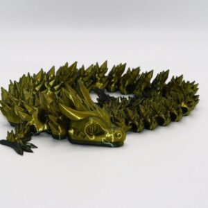 Articulated dragon fidget toy with movable segmented body and detailed head.Articulated dragon fidget toy with movable segmented body and detailed head.