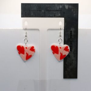 pair of dangler earrings that have a heart full of smaller hearts