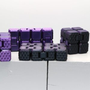 Infinity Cube fidget toy folding cube with black panels for stress relief.