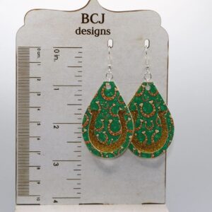 Pair of earrings shaped like bright green faux leather horseshoes.