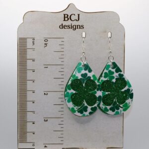 Pair of earrings shaped like bright green faux leather clovers.