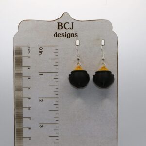 air of earrings featuring a pot of gold with rainbow details.