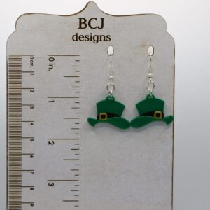 Pair of earrings shaped like green leprechaun hats with gold buckles.