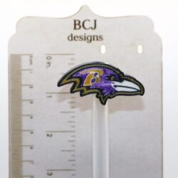 Baltimore Ravens logo straw topper clipped to a straw