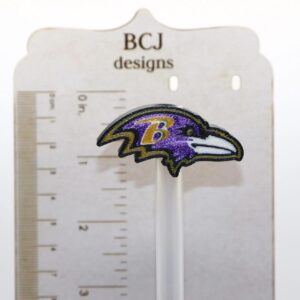 Baltimore Ravens logo straw topper clipped to a straw