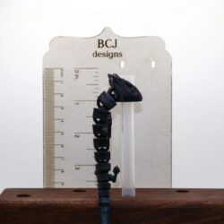 Articulated dragon straw topper with detailed wings and body.
