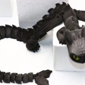 Night Fury black dragon fidget toy with wings and tail details.