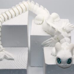 White Fury dragon fidget toy with detailed wings and tail.