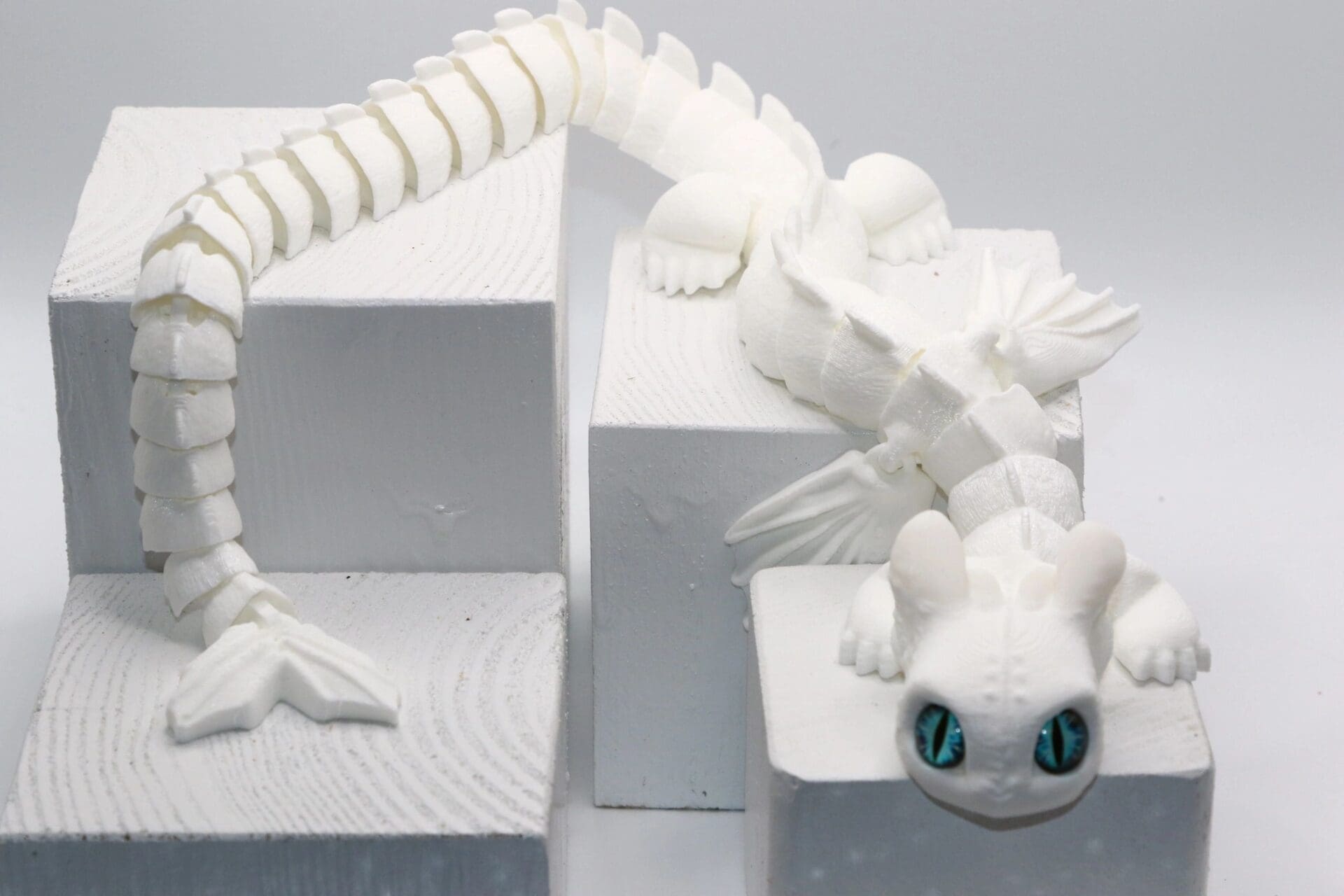 White Fury dragon fidget toy with detailed wings and tail.