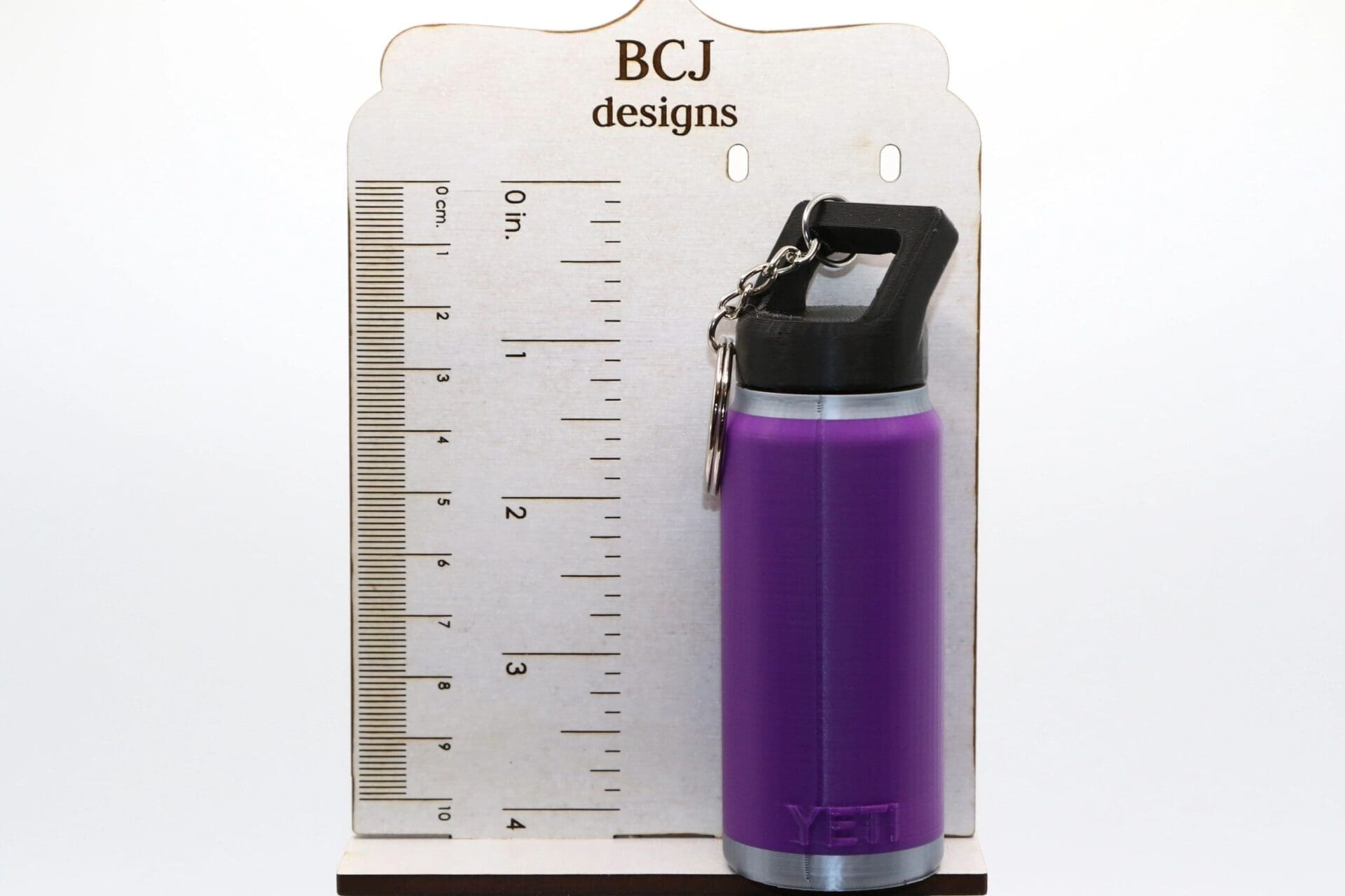 Yeti chapstick holder keychain with playful design