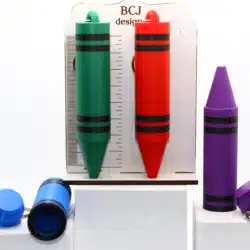 Crayon-shaped chapstick holder keychain in bright colorsCrayon-shaped chapstick holder keychain in bright colors