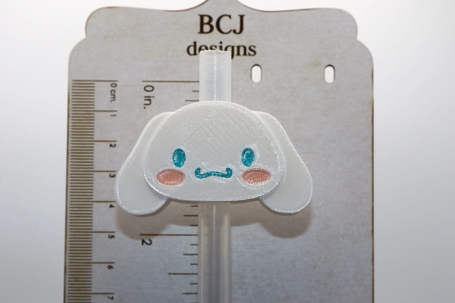 Cinnamoroll character straw topper on a drinking straw