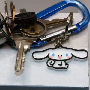 Cinnamoroll keychain with floppy ears and smiling face