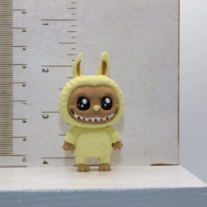 Labubu straw topper featuring whimsical character design.