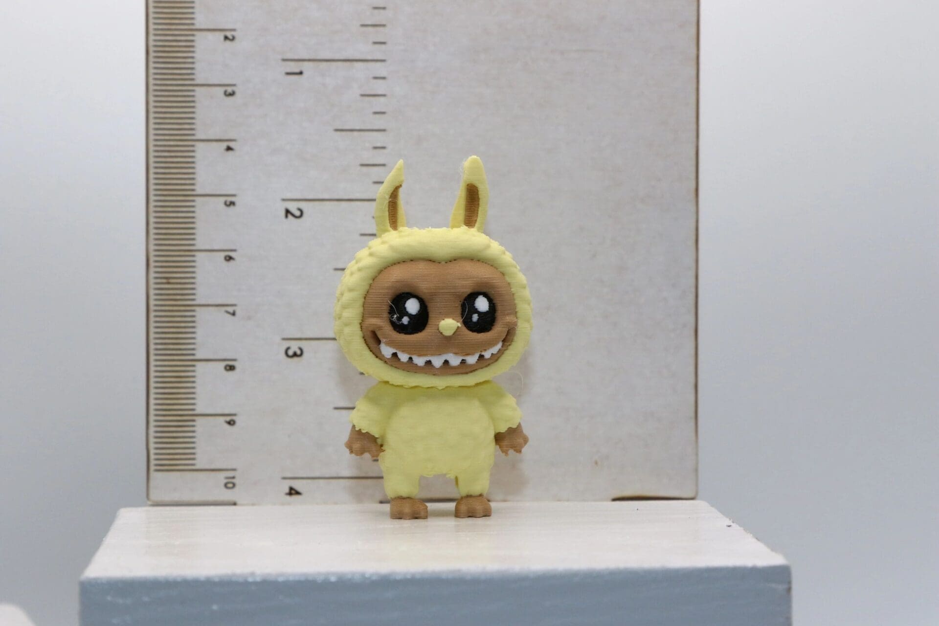 Labubu straw topper featuring whimsical character design.