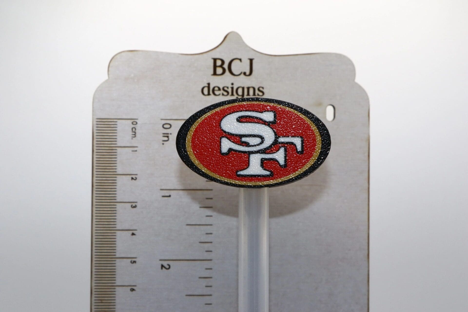 San Francisco 49ers logo straw topper attached to a straw