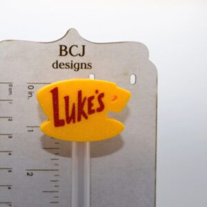 Luke’s Diner straw topper with yellow coffee cup design.