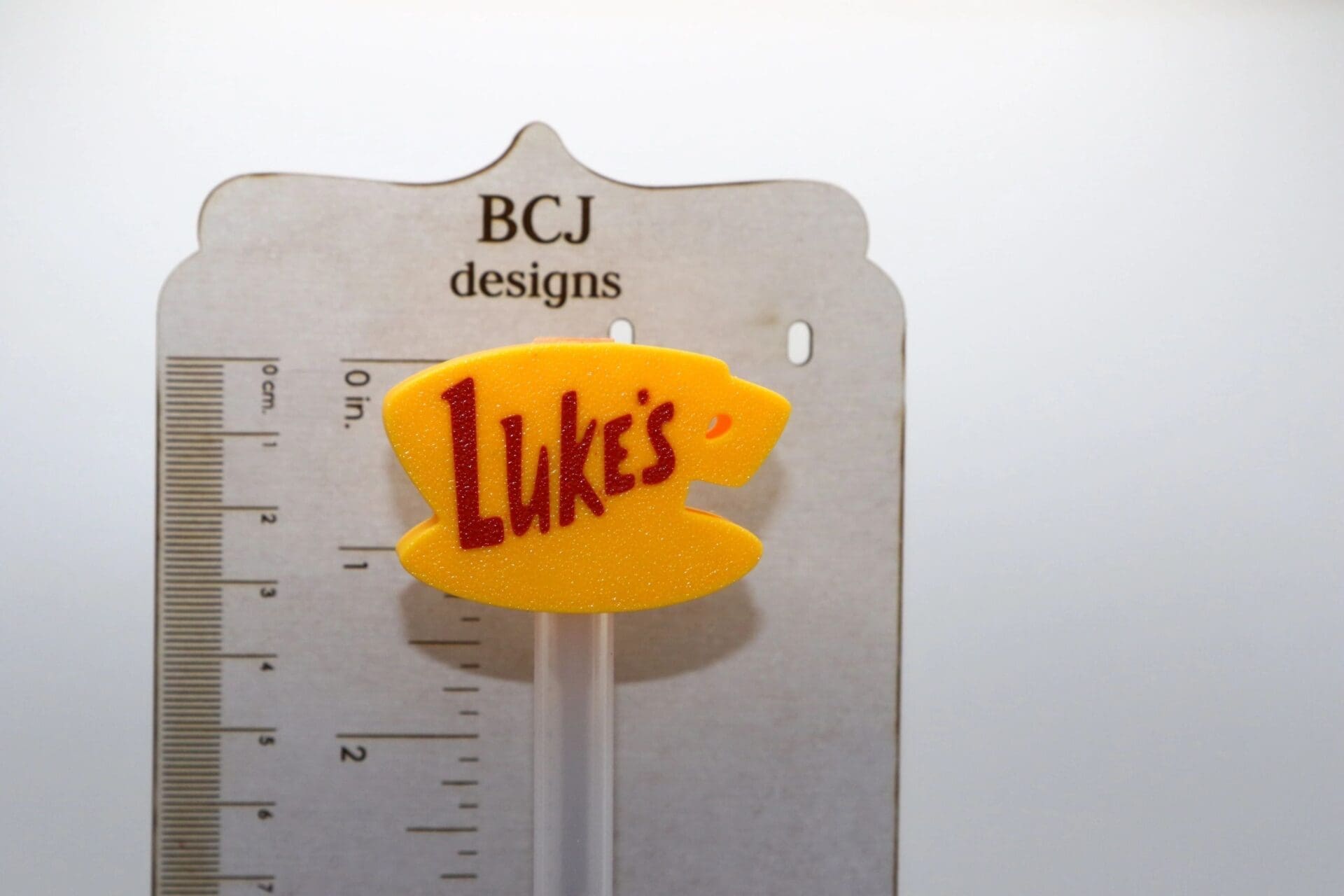 Luke’s Diner straw topper with yellow coffee cup design.