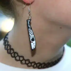 Knife-shaped earrings featuring Jason silhouette on the blade