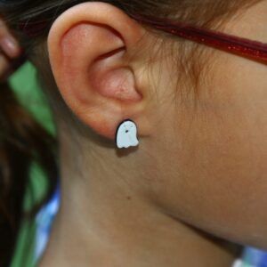 ghost stud earrings on an ear