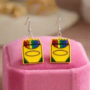 Pair of earrings featuring a colorful box of crayons with multiple hues.