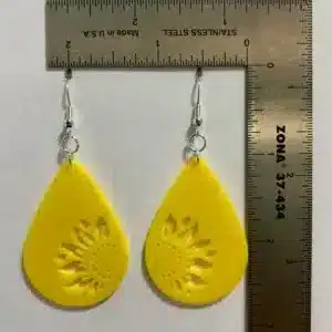 Teardrop sunflower earrings with detailed elongated design.