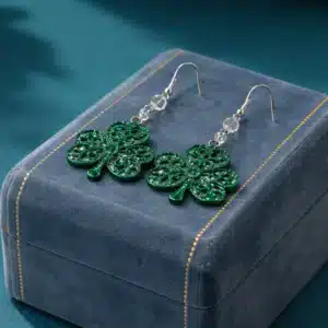 Pair of earrings featuring a swirling green shamrock