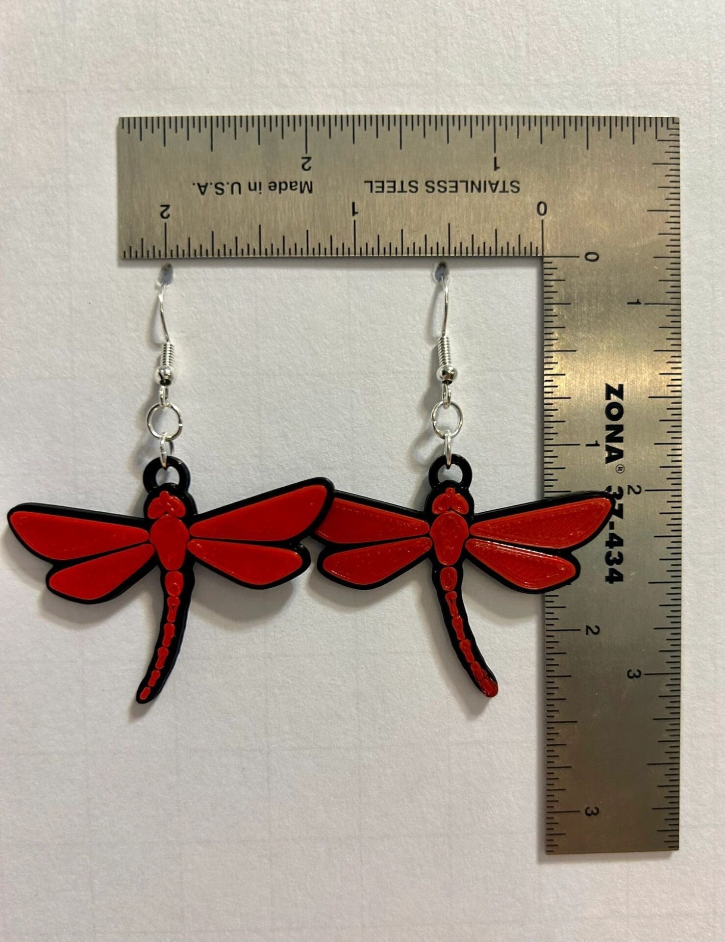 Dragonfly earrings featuring detailed dragonfly design.